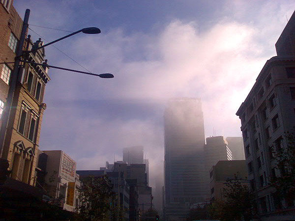 Photograph of George Street, Sydney, showing buildings in the distance partially obscured by fog