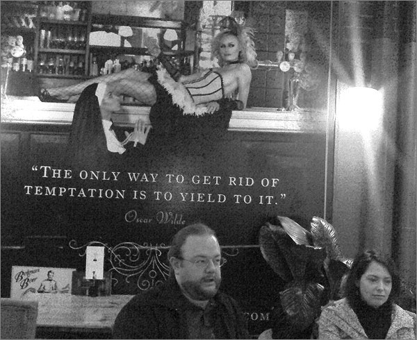 Photograph of poster quoting Oscar Wilde: The only way to get rid of temptation is to yield to it