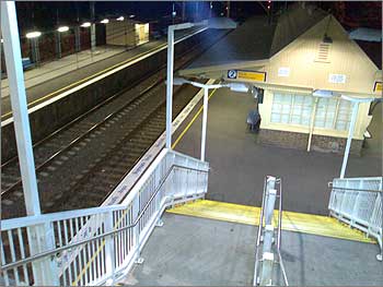 Photo of stairs descending to the deserted platform at Gordon Station