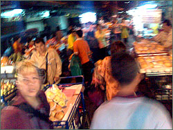 Photograph of a crowded market street in Chinatown, Bangkok