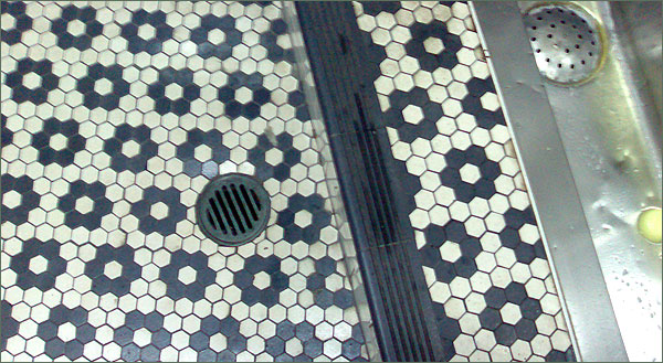 Photograph of hexagonal tiles on the toilet floor, Lansdowne Hotel, Sydney