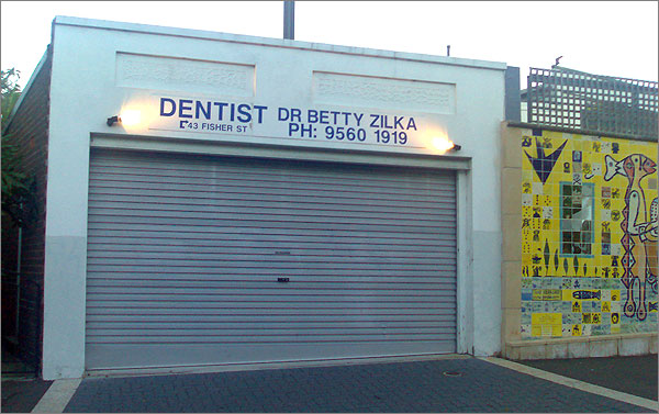Photo of dentist premises with garage-style roll-up door