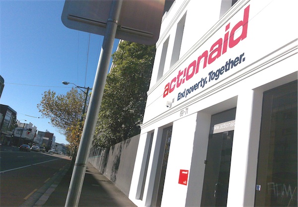 Photo of ActionAid Australia office, showing slogan: End poverty. Together.