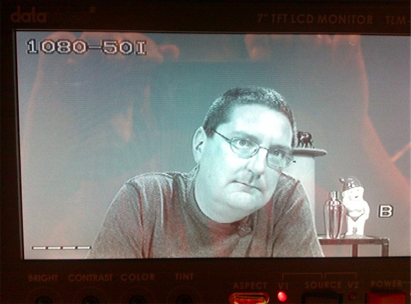 Photo of monitor at Metro Screen showing Stilgherrian on camera, waiting for his cue
