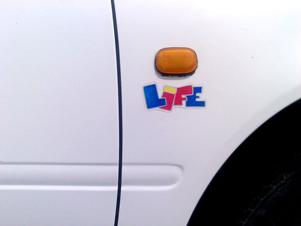 Photograph of Life sticker on a car
