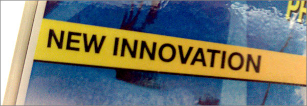 Photograph of advertising sign reading: New Innovation