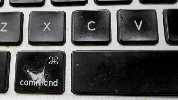 Photograph of MacBook Pro showing keyboard damage