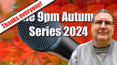 In front of a stock photo of bright orange and red autumn leaves sits Stilgherrian, a lumpy man in a grey sweater and spectacles. There is a giant microphone for some reason, as if you don’t know how they make podcasts. The text reads "The 9pm Autumn Series 2024" with a banner over the top reading "Thanks everyone!". But why isn’t he smiling? What a prick.