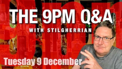 Against a background of bottles of alcohol and the huge letters "9pm" sits a white man in a grey t-shirt and spectacles. It's Stilgherrian! The text reads "The 9pm Q&A with Stilgherrian" and "Tuesday 9 December".